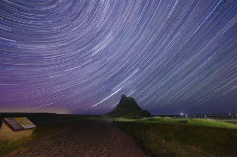 Tom Wright Rings of light can be seen in the night sky