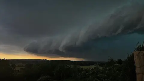 A storm in dark skies rolling in over Glastonbury