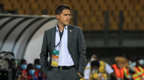 Johnny McKinstry on the touchline during a match with Uganda