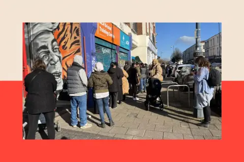 A queue forms outside St Pauls Dental Surgery in Bristol

