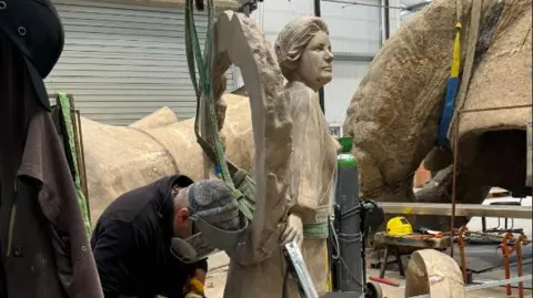 Monumental Welsh Women Statue in workshop being sculpted