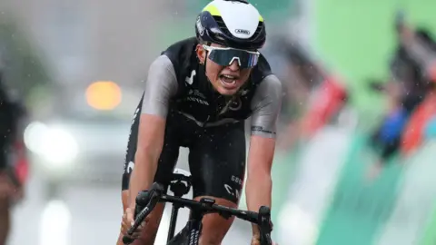 Cat Ferguson crosses the finish line