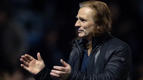 Gareth Ainsworth claps fans following night match