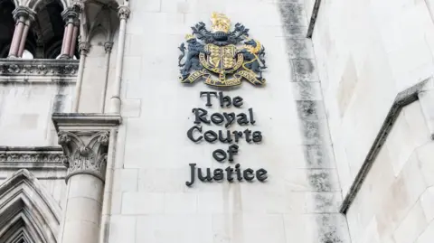 Getty Images Extride Close Up is a sign of the Royal Courts of Justice in London
