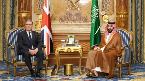 PA Media Then-UK Prime Minister Keir Starmer sits on the left of the picture with Saudi Crown Prince Mohammed bin Salman on the right in Jeddah, Saudi Arabia 