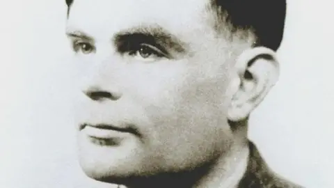 Black and white photo of Alan Turing 