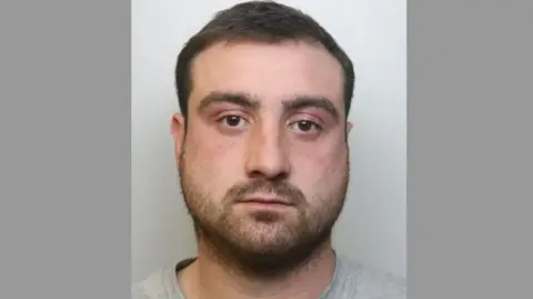 Avon and Somerset Police A custody mugshot of George Baylis