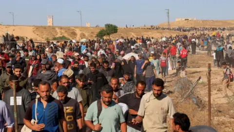 Many Palestinians gather to collect aid supplies from the Gaza Humanitarian Foundation in Khan Younis