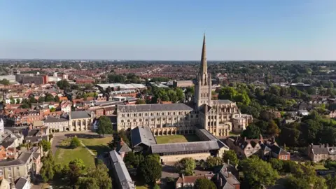 An aerial view of Norwich Cathedral and its grounds.