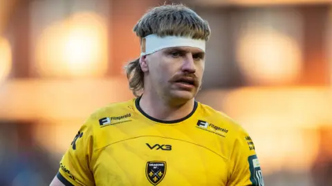 Dragons number eight Aaron Wainwright in action against Cardiff