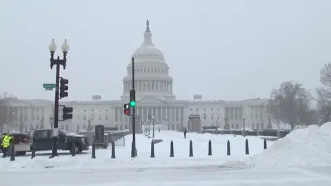 The Capitol building surrounded by snow