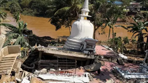 Irie Perera A collapsed temple where the top is still mostly intact, but the foundation underneath has entirely given way