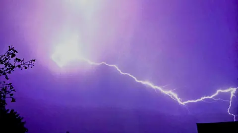 Lightning strike on a purple sky 