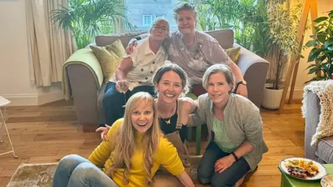 Lucy Turner Five women including Lucy in a house.