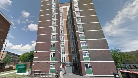 Google A view of the exterior of Cropley House, a high-rise brick building in east London