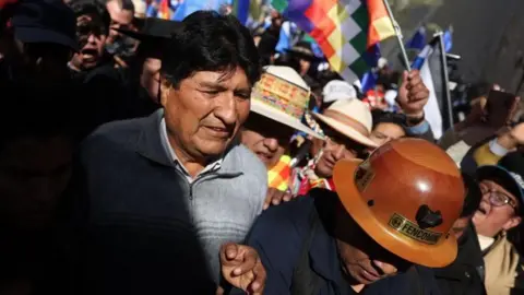 EPA Former Bolivian President Evo Morales (C) arrives at the Supreme Electoral Court headquarters in La Paz, Bolivia, 10 July 2024. 