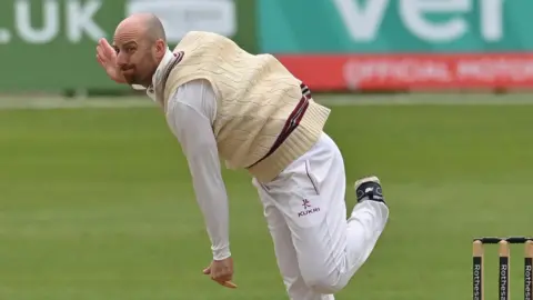 Former England spinner Jack Leach bowling for Somerset