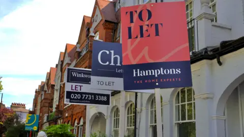 Getty Images To let signs outside a row of properties.