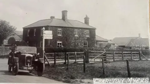 Martin Beal A black and white photograph dating from the 1920s shows a car of the era parked outside Charlton Mires, which is a square Georgian farmhouse. 