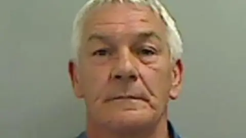 Cleveland Police Mugshot of Jeffrey, He is clean shaven with short white hair