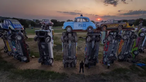 Matt Cardy A drone image shows Carhenge at sunrise during the 2023 solstice 