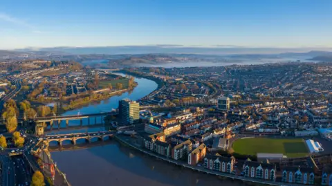Getty Images An aerial view at sunrise of Newport city centre, south wales United Kingdom, taken from the River Usk.