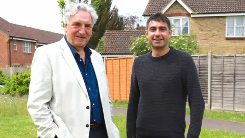 Jim Carter OBE with councillor Salman Shaheen at one of the plots