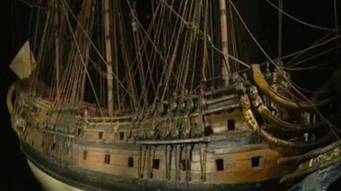 Touch Productions A CGI of one side of the London, a Commonwealth-era wooden ship, with its riggings and a flag