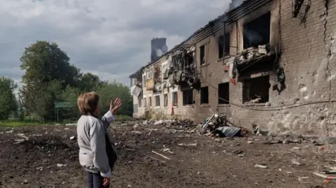 Yakiv Liashenko/Anadolu via Getty Images A view of the damaged building after the Russian shelling on Vovchansk in Kharkiv, Ukraine on May 11, 2024