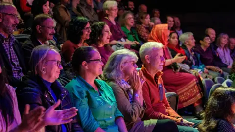 Bradford Literature Festival People clapping while sitting in an audience