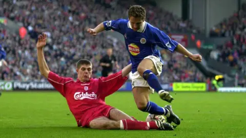 Ross Kinnaird/Allsport/Getty Liverpool's Steven Gerrard sliding in and tackling Darren Eadie of Leicester City during a league match.