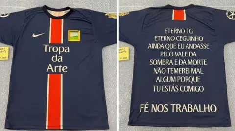 Nottinghamshire Police A blue and red football top with Brazilian Portugese writing on the back