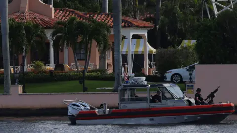 Reuters The US Coast Guard inspects a boat outside US President-elect Donald Trump's Mar-A-Lago home 