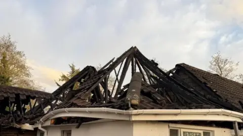 Essex County Fire and Rescue Service A burnt-out shell of the roof of one of the homes.
