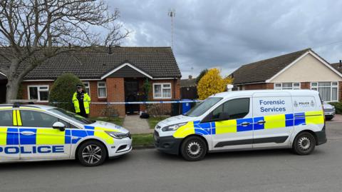 Forensic services outside the house of the woman who died in Pakefield, Suffolk