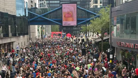 Great Birmingham Run Thousands of people, including runners and spectators, pack the streets in Birmingham city centre for the half-marathon.