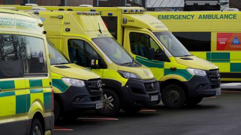 Ambulances queue outside a hospital A&E 