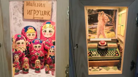 The Rumble Museum A collage of two pictures showing lockers with a set of Russian nesting dolls, which has a sign in Russian reading "Toy Shop", and a tiny typewriter with a poster of a cat above it.
