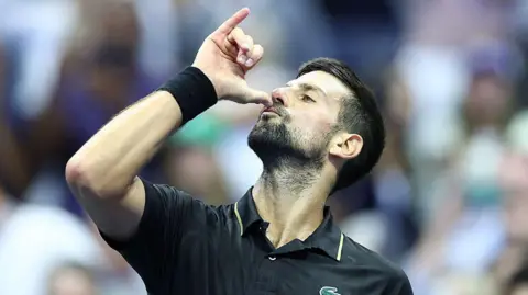 Novak Djokovic celebrates after defeating Taylor 