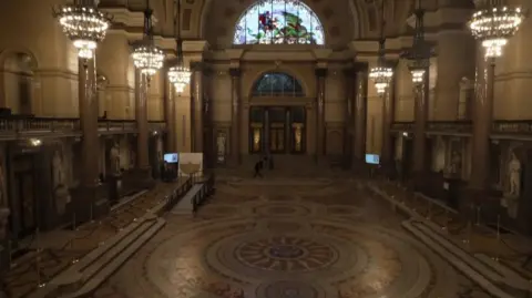The Minton tiles floor at St George's Hall with chandeliers lighting them up