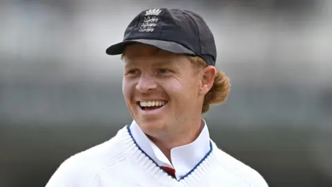 England's Ollie Pope smiles