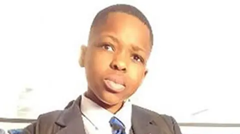 Daniel Anjorin wearing his school uniform 