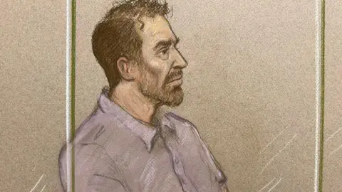 Julia Quenzier A court artist's sketch of a man in a short sleeved shirt with brown hair and a short beard, looking to the right.