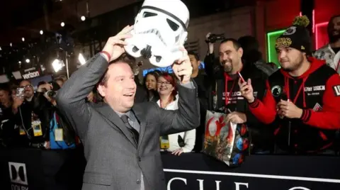 Getty Images Gareth Edwards with stormtrooper helmet on the red carpet