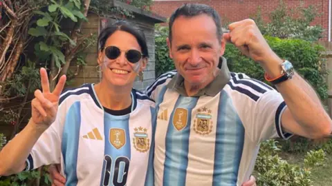 Baqueano Ltd/Malo Brighton Ltd Adriana Torrembo and her husband wearing their Argentina kits