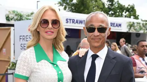 Getty Images Amanda Cronin and Andrew Ridgeley attend day 2 of the Wimbledon Tennis Championships 2022 at All England Lawn Tennis