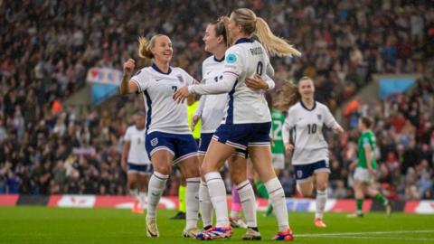 England women's team hugging