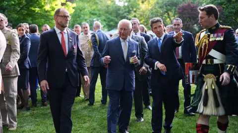 Getty Images King Charles III and British Ambassador to the US Christian Turner at the garden party