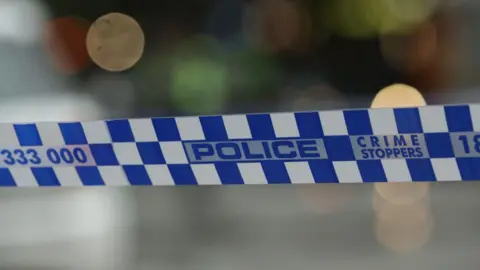 File photo of police tape in Melbourne 