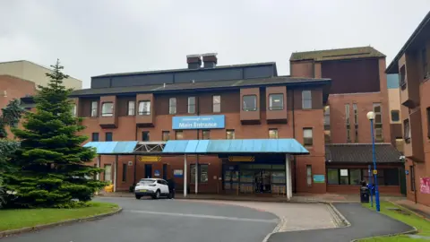 LDRS Entrance to Scarborough Hospital- a three storey brick building